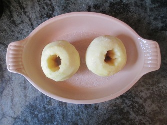 apples sprinkled with sugar and rosewater in a baking dish