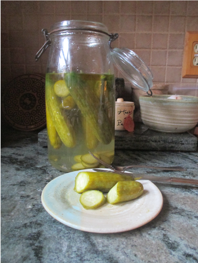 pickled cucumbers in jar and on plate